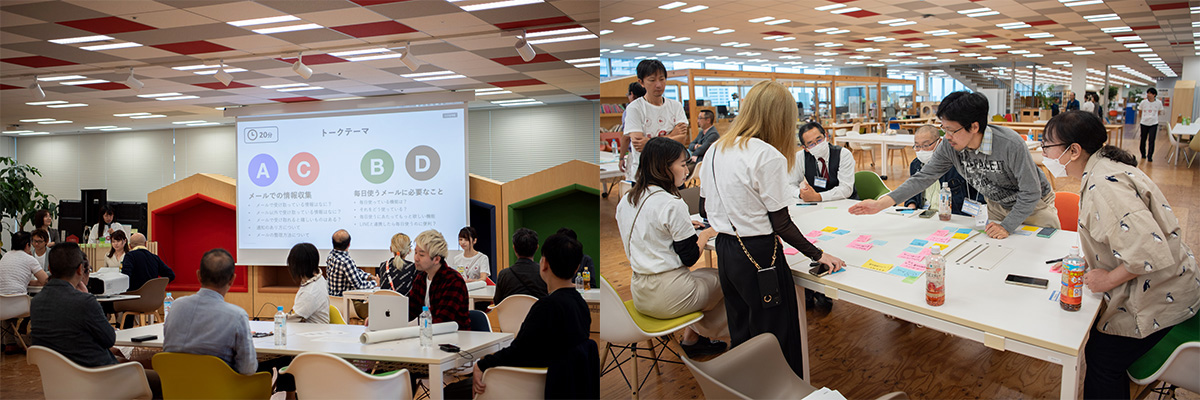 会議室でプレゼンテーションが行われています。参加者がテーブルを囲んでアイデアを共有しています。