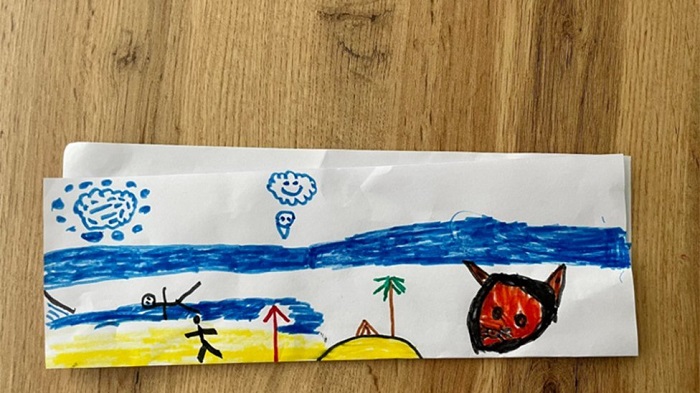 エイネさんの友人の4歳の子どもが、防空壕で過ごした夜に描いた絵。人々が大きな赤い悪魔から逃げている様子が描かれている