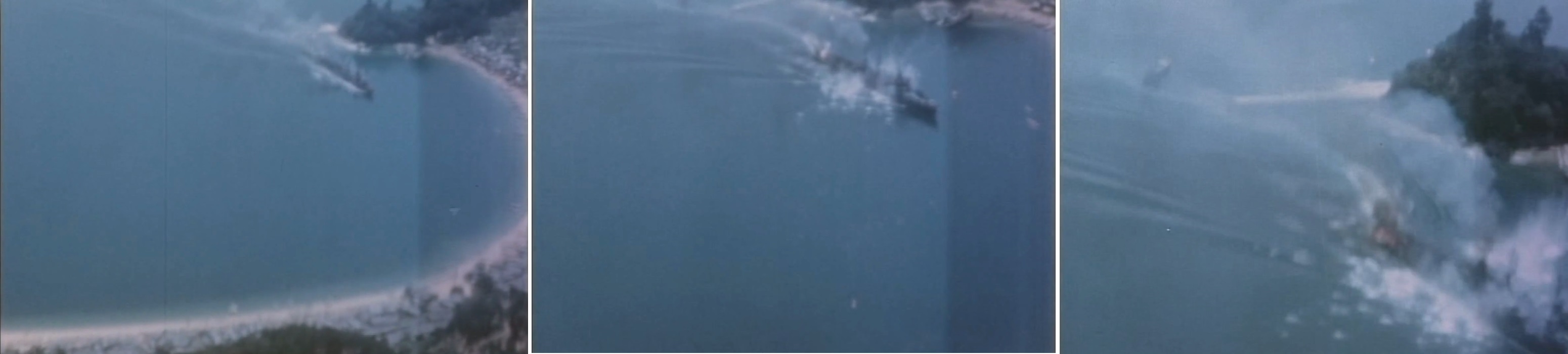 激しい攻撃を受け火炎を吐きながら津和地島に近づく第２１号輸送艦の様子を捉えた米軍機のガンカメラ映像
