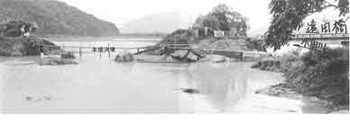 昭和47年7月梅雨前線による小田川の破堤状況：高梁川において、全半壊1戸、床上浸水2,144戸、床下浸水5,203戸の被害が発生